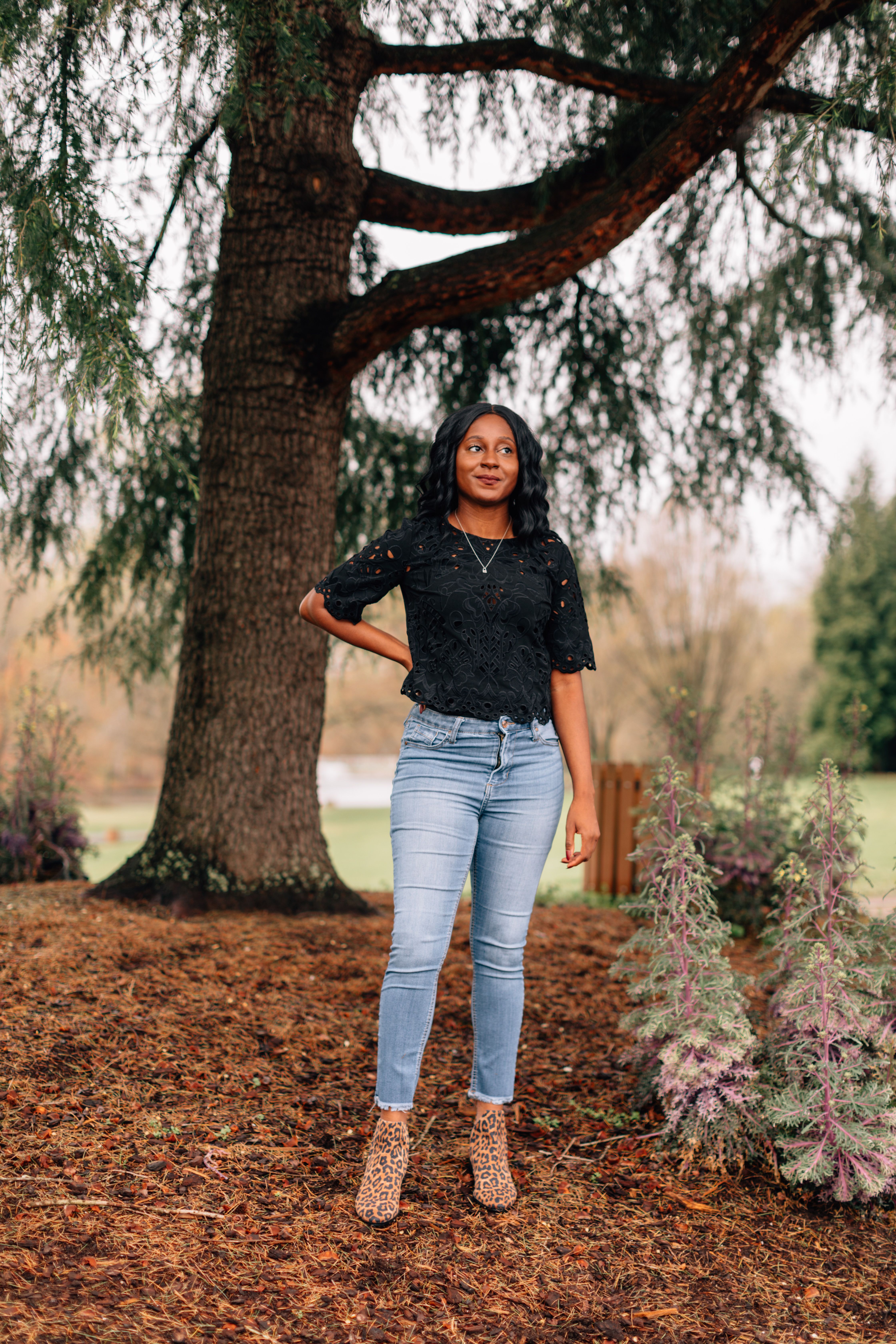 Monica standing in front of a tree